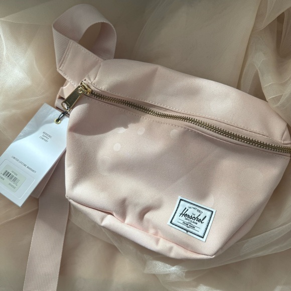 Herschel Supply Company Handbags - Herschel Supply Company Pale Pink Crossbody Bag with Adjustable Strap